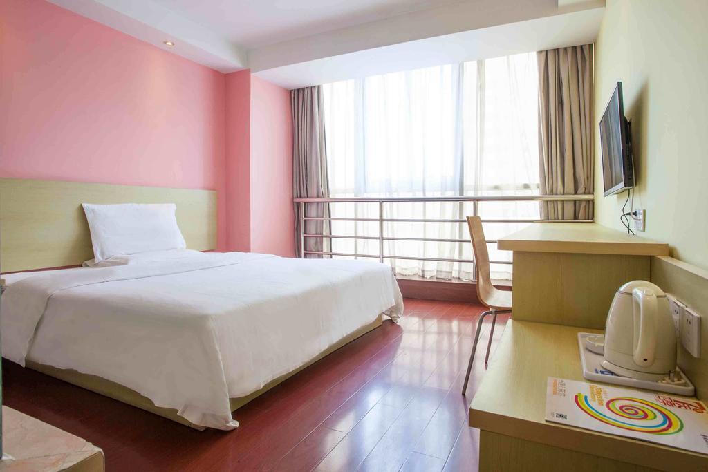 7 Days Inn Meizhou Jiangnan Kedu Commercial Plaza Room photo